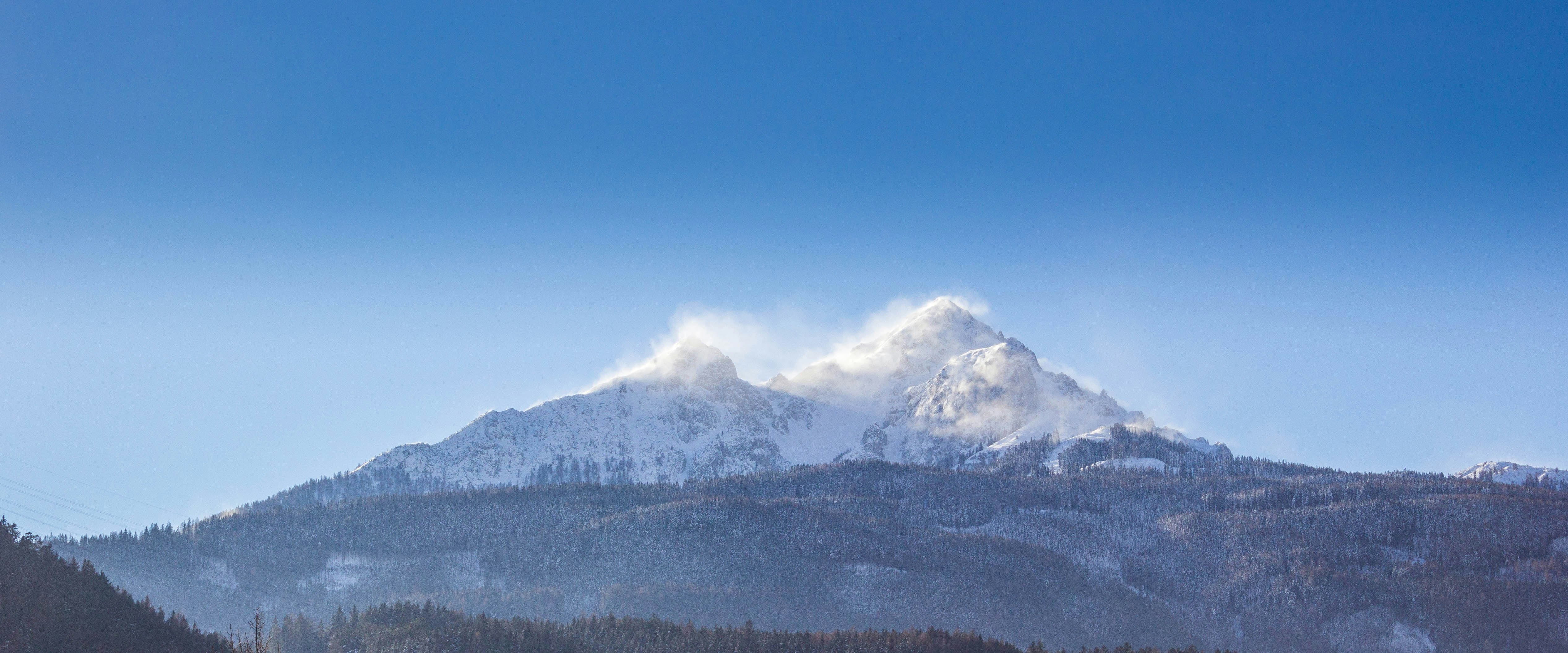 white and brown mountain under clear blue sky